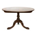 A George III mahogany tilt top dining table,