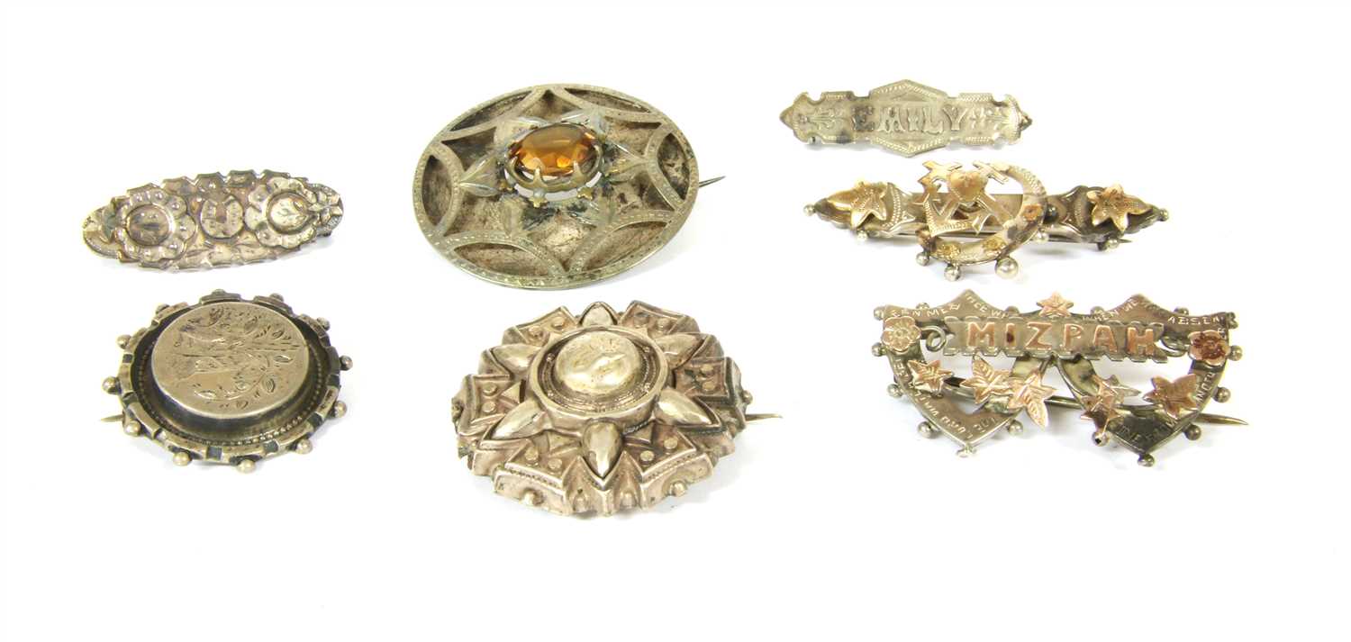 Thirty eight early 20th century silver brooches,