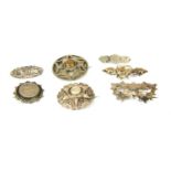 Thirty eight early 20th century silver brooches,