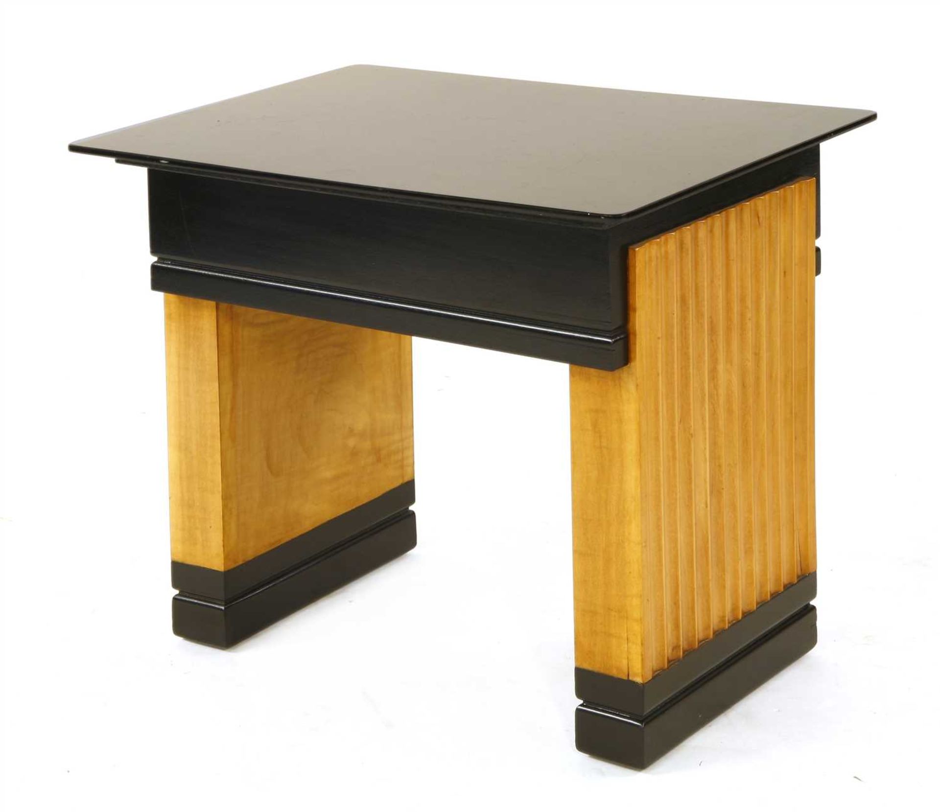 An Art Deco maple and ebonised coffee table,