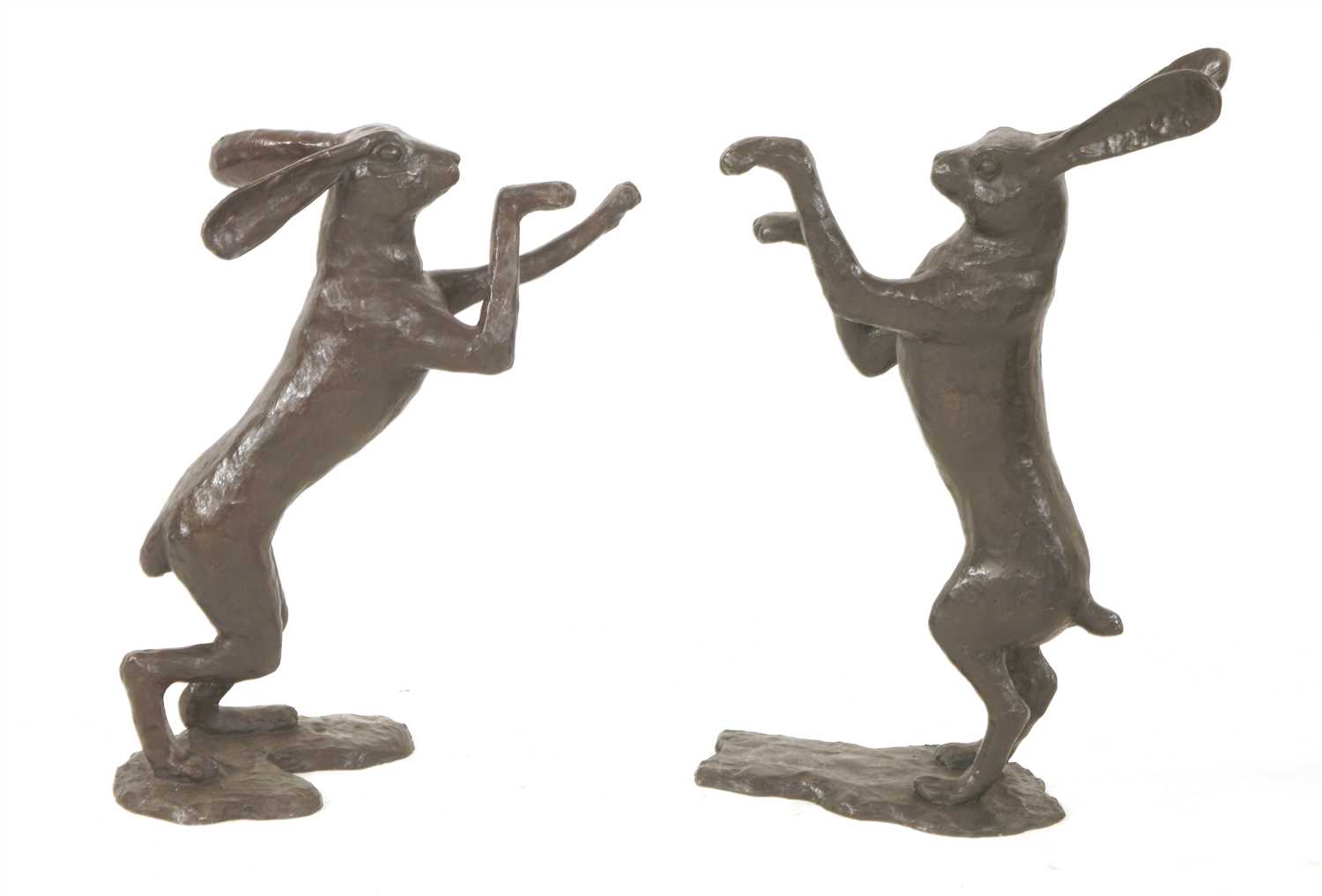 A pair of bronze boxing hares,