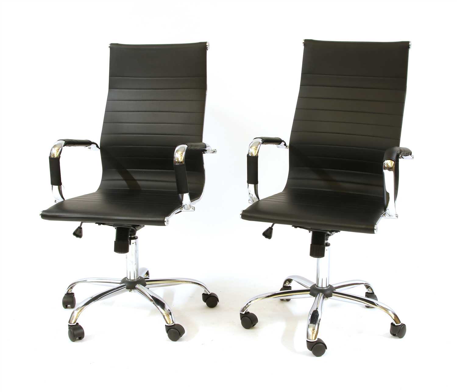 A pair of Eames style chromed office chairs