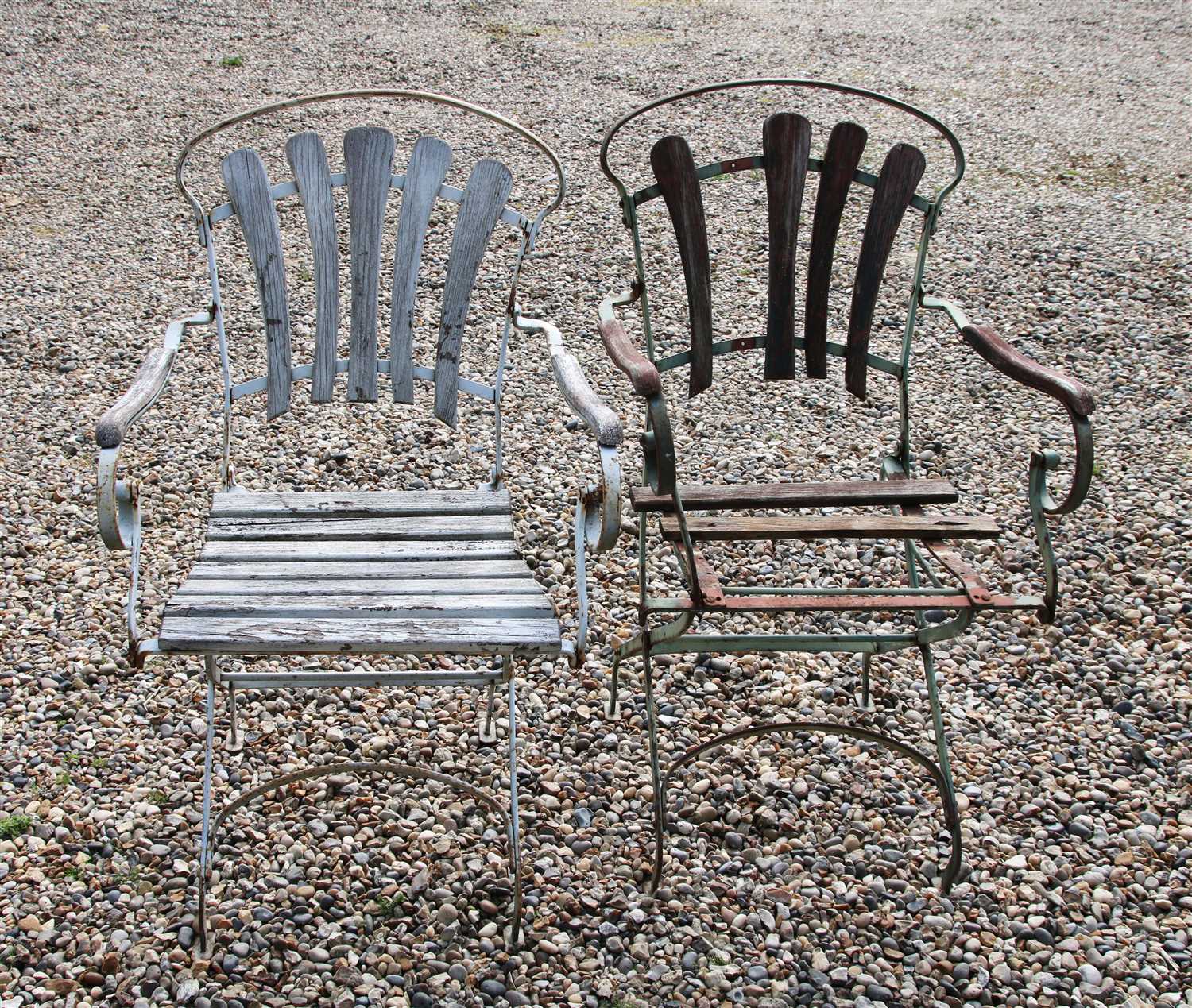 A pair of folding iron chairs