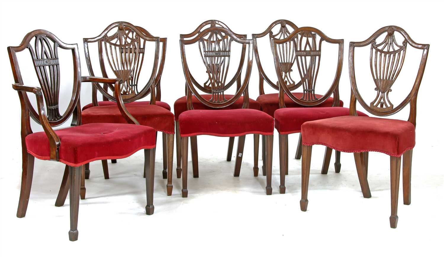 A set of four George mahogany Hepplewhite style shield back chairs,