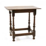 A 17th century and later small oak table,