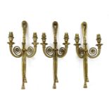 A group of three early 20th century brass wall lights,