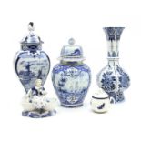 A Delft vase and cover with pictoral reserves,