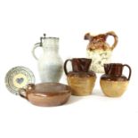 A collection of glazed stoneware jugs,