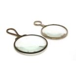 A silver magnifying glass,