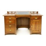 An Arts & Crafts oak pedestal desk,