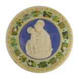 A Della Robbia pottery Madonna and Child tondo,