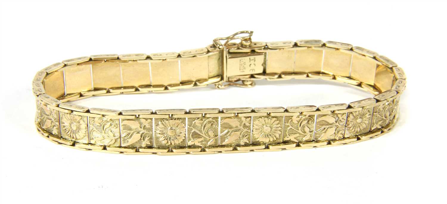 An engraved plaque link bracelet