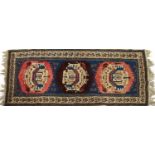 A woollen Persian Belouch design rug,
