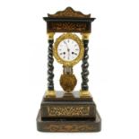 An ebonised portico eight day mantel clock,