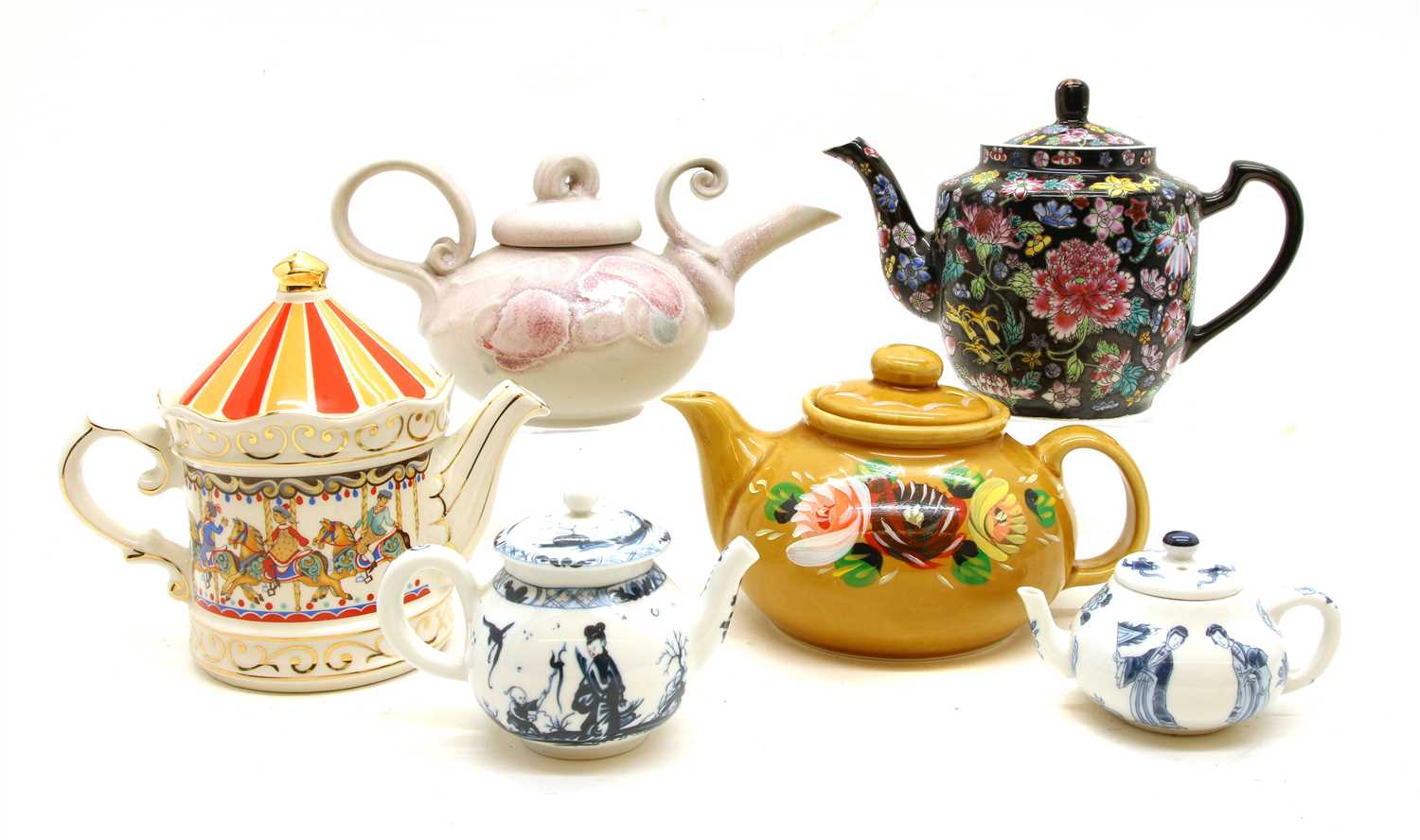 A collection of 27 decorative teapots,