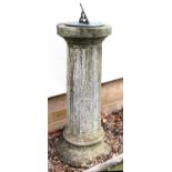 A bronzed sundial set on a reconstituted stone fluted column,