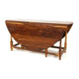 A yew wood drop flap table,