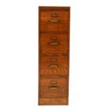 An oak four drawer filing cabinet,