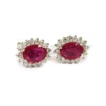 A pair of white gold ruby and diamond cluster stud earrings