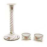 A Bilston or Battersea enamel candlestick,