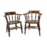 Two elm captain's chairs,