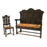 A 19th century carved hall settle,