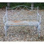 A wrought iron painted garden bench