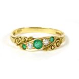 An 18ct gold emerald and diamond five stone ring