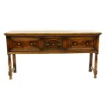 An 18th century and later oak dresser base,