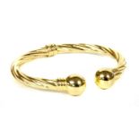 An Italian 9ct gold hinged torque bangle,