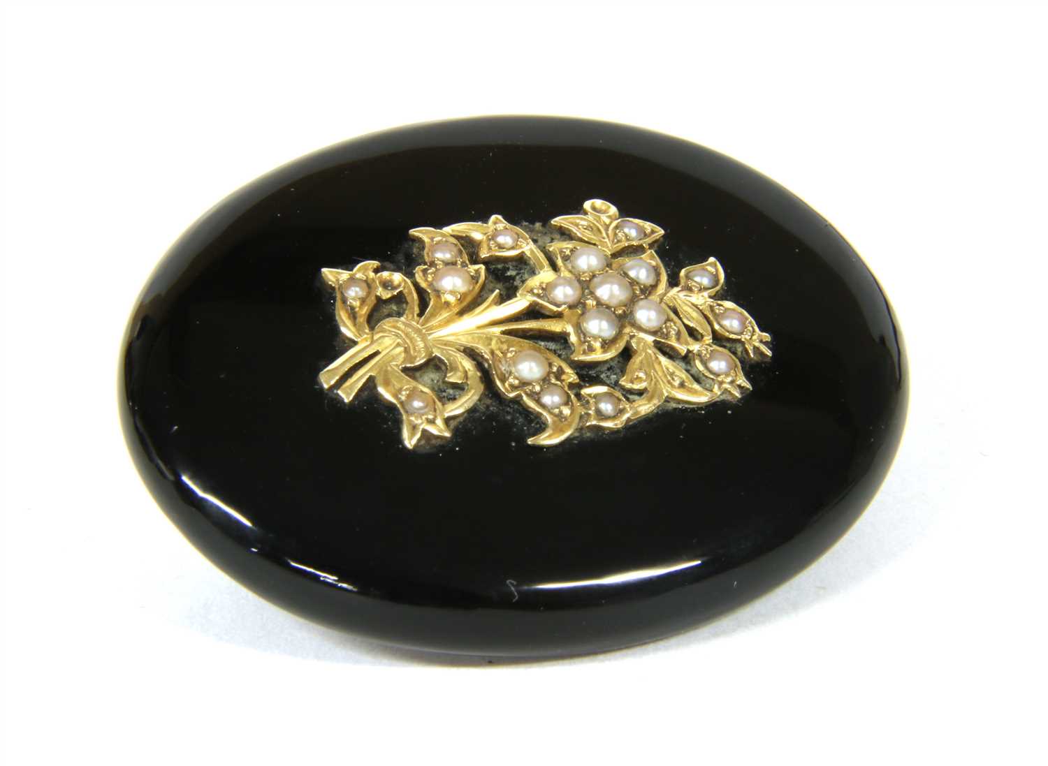 A Victorian onyx and split pearl brooch,