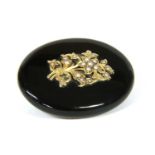 A Victorian onyx and split pearl brooch,