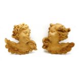 A pair of carved wooden heads,