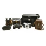 A quantity of cameras and binoculars,