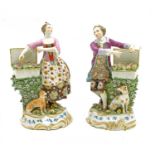 A pair of 19th Century English porcelain figures,