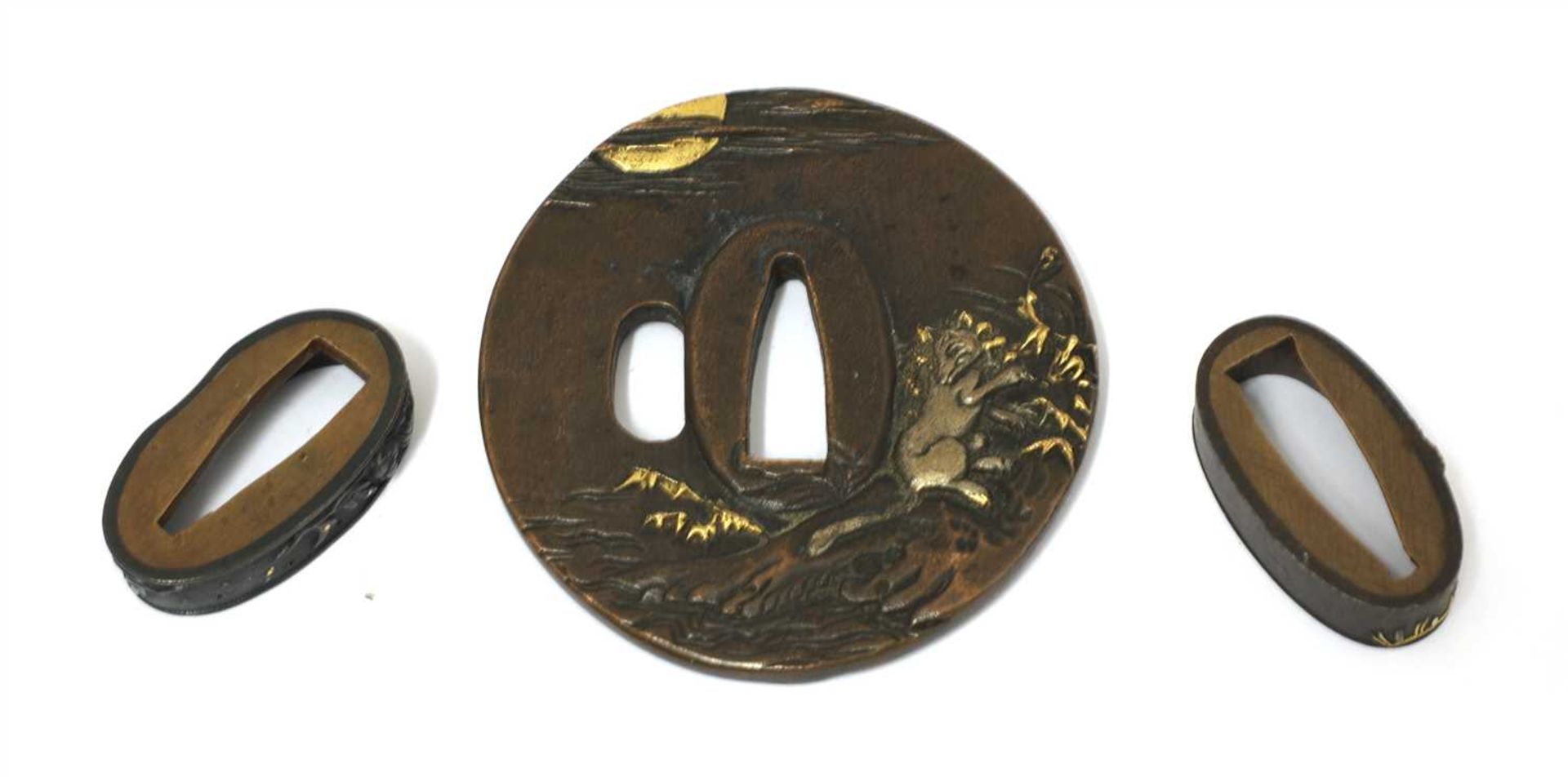 A Japanese shakudo tsuba,