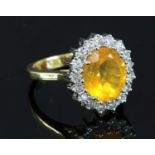 An 18ct gold fire opal and diamond cluster ring,