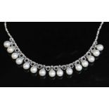 A white gold diamond and cultured freshwater pearl fringe necklace,
