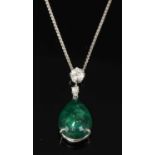 An 18ct white gold emerald and diamond pendant,