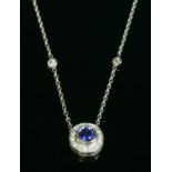 A white gold sapphire and diamond cluster necklace,