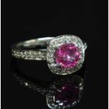 An 18ct white gold pink sapphire and diamond cushion-shaped cluster ring,