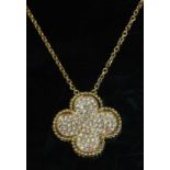 A rose gold diamond set quatrefoil pendant,