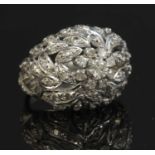 A white gold diamond bombé ring,