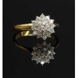 An 18ct gold three-tier diamond cluster ring,