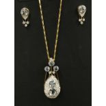 An 18ct gold aquamarine and diamond pendant/brooch and earring suite, c.1980,