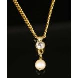 A diamond and cultured pearl pendant,