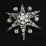 A Victorian diamond set star brooch,