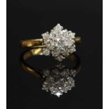 A two colour gold diamond set snowflake cluster ring,