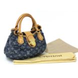 A Louis Vuitton denim pleaty bag