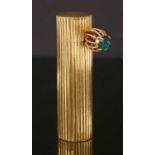 An 18ct gold and silver emerald set Cartier lipstick holder, c.1950,